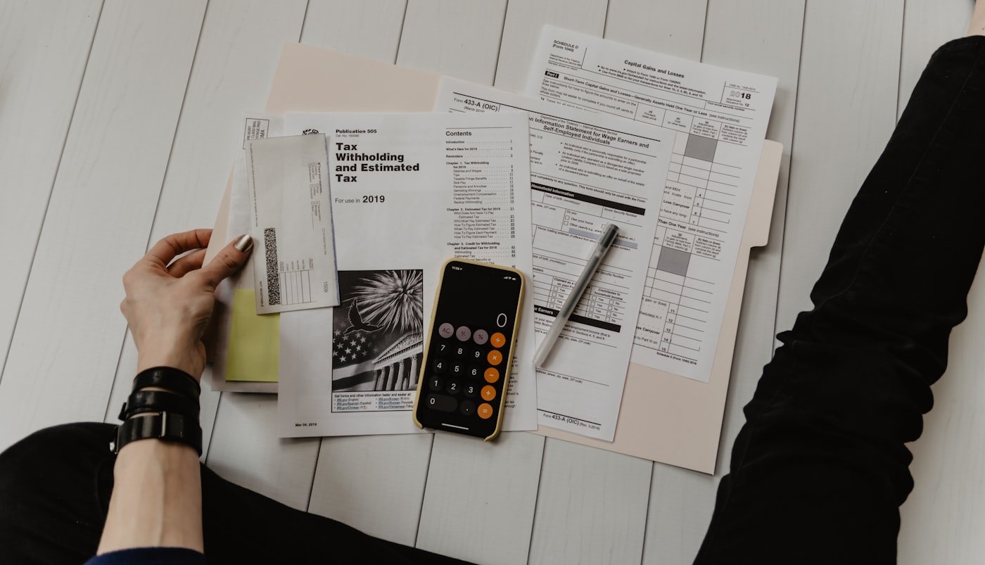 Calculator and financial paperwork representing structured forms