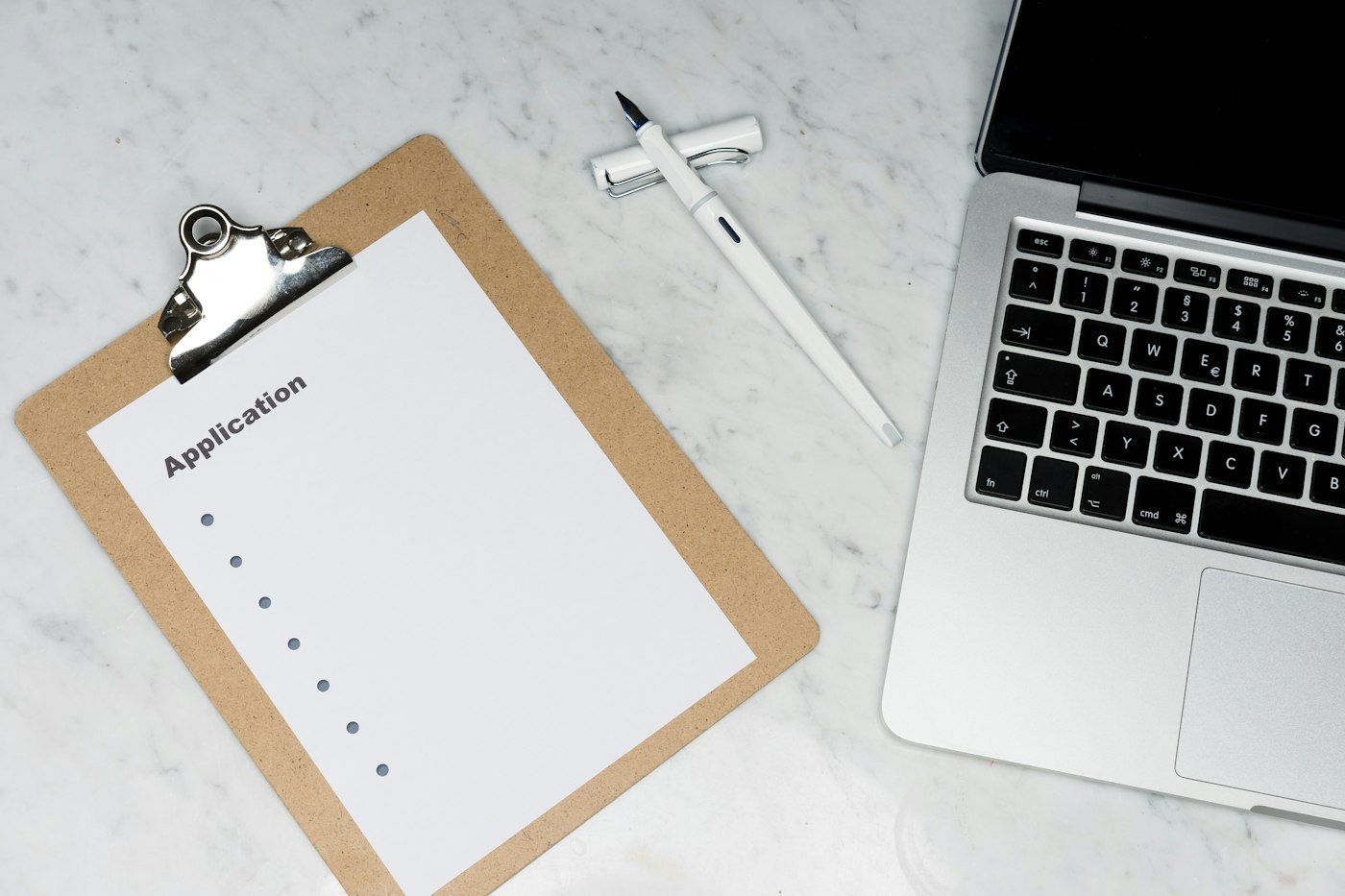 Desktop workspace with documents prepared for a single PDF pack