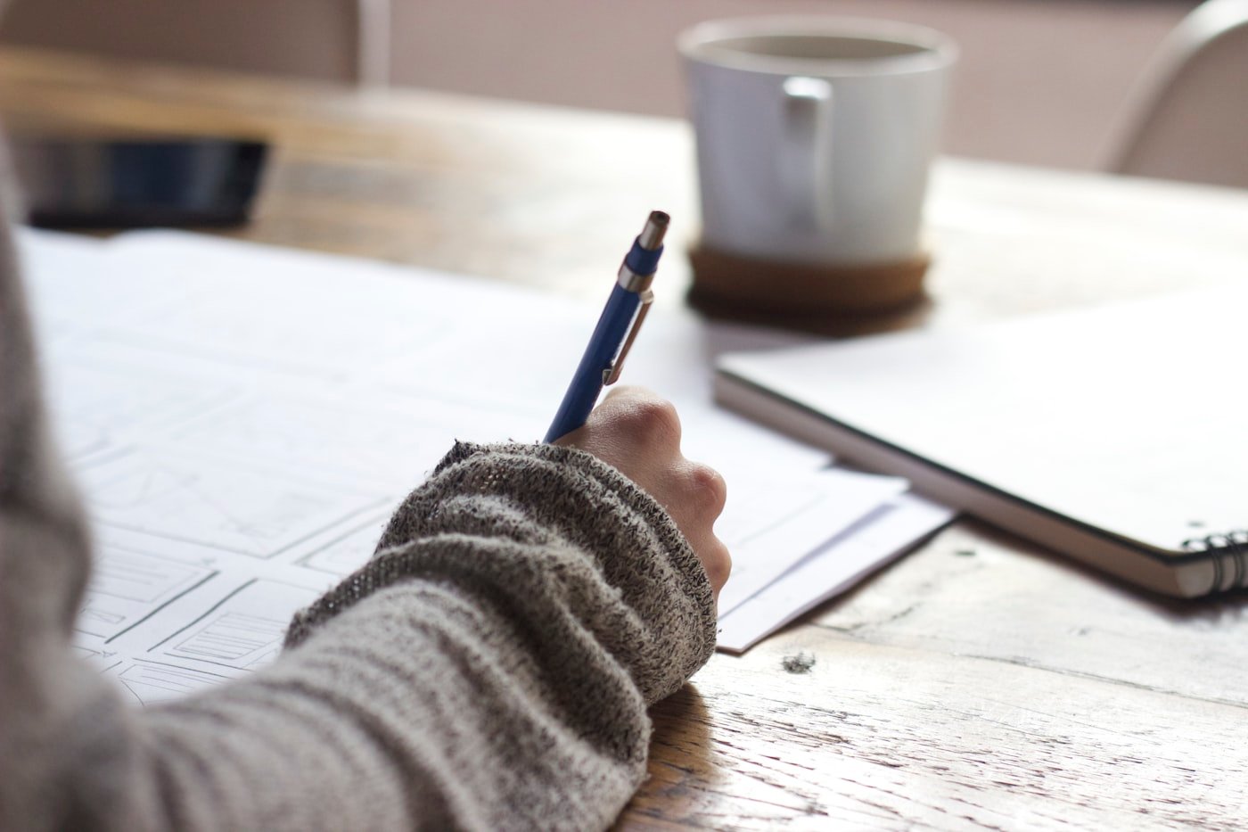 Checklist and paperwork prepared on a desk for a job application pack